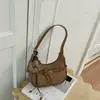 Bolso versátil de moda estilo coreano transfronterizo para el trabajo, modelo nuevo de nicho otoño 2026, bolso de mano para mujer, bolso tipo dumpling para hombro y cruzado
