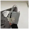 Bolsa Pequena de Mão Texturizada da Moda para Mulheres 2025 Novo Verão Ins Versátil Bolsa para Celular Estilo Coreano Popular Bolsa Transversal