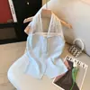 Camisola de Encaje Dulce Estilo Francés con Parches, Cuello Halter para Mujer, Verano 2026, Elegante, Ajustado, Top Corto de Moda