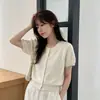 Estilo Coreano Novo Outono Gola Redonda Fivela Redonda de Metal Cor Sólida Manga Curta Tricô Cardigan Estilo Pequeno Fresco Manga Curta Atacado