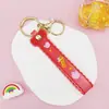 Chaveiro Pingente de Corda de Couro com Letra Transparente Brilhante com Acessórios Estilo Boneca Preenchida com Óleo Pingente de Chaveiro Pulseira Atacado