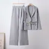 Abrigo de solapa profesional estilo europeo y americano conjunto de moda para mujer primavera y otoño de punto de alta gama adelgazante falda de cadera envolvente conjunto de dos piezas