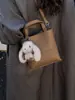 Bolso Cubo Pequeño Versátil de Alta Calidad Transfronterizo 2026 Bolso de Hombro Versátil de Nicho para Viajes Diarios Bolso Cruzado Simple para Mujer