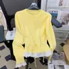 Suéter dulce y juvenil estilo coreano, falso dos piezas, con ribete de encaje y cinturón, para mujer, nuevo cárdigan de punto para otoño e invierno, para mujer