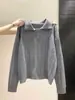 Suéter de punto tipo polo coreano para mujer, con diseño de tres botones, tela suave y cómoda, corte corto y holgado, y estilo dulce de manga larga, perfecto para otoño e invierno.