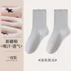 Calcetines Zhuji para mujer de media pantorrilla estilo cuatro estaciones lunares camelia calcetines para mujer casual versátil fruncido lateral oreja al por mayor modernos