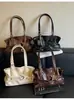 Colección de otoño 2026 transfronteriza: bolso de mano de diseño único, gran capacidad, moderno y casual, con una textura única y un diseño elegante, bolso de hombro para mujer