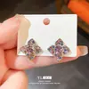 Brincos de Agulha de Prata Luxo Leve Flor de Trevo de Quatro Folhas Pétala Laço de Diamante Personalidade Nicho Elegante High-end para Mulheres