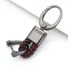 Chaveiro de carro de corda de couro trançado novo do fabricante, simples para homens, liga de zinco, padrão de pendurar na cintura, fivela de cabeça grande, cordão