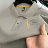 Camiseta Masculina de Algodão Puro de Manga Curta Verão 2026 Novo Estilo Camisa Polo Masculina Casual Gola Lapela Bordada Manga Meia