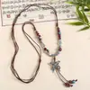 Collar con colgante de campana de mariposa de cerámica de estilo étnico retro para mujer, diseño nuevo y moderno, cadena larga para suéter, accesorios
