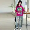 Traje de Verano de Manga Corta para Niñas 2026 Nuevo Estilo Conjunto Casual y Elegante de Dos Piezas con Jeans Holgados para Niños Mayores