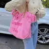 Bolsa Tote de Lona Tecida com Franjas e Letra Bordada Grande Capacidade Bolsa de Ombro Feminina 2026 Novo Estilo Casual para Viagem