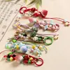 Llavero de fresa estilo ins de Jingdezhen, colgante de cerámica para bolso estilo étnico, accesorios artísticos de puesto de mercado nocturno, suministro del fabricante
