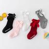 Calcetines nuevos de color liso a rayas hasta la rodilla para niños y niñas, algodón poliéster antideslizantes con parte superior de burbujas, calcetines de media pantorrilla con lazo para bebé al por mayor
