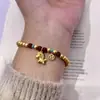 Pulseira de Flor de Íris Nova Chinesa Micro-incrustada de Luxo Leve Design de Nicho Ins Laço Trevo de Quatro Folhas Pulseira Fashionável Versátil
