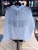 Marca de tendencia transfronteriza ropa de protección solar NK reflectante para hombre y mujer verano exterior correr fitness entrenamiento con capucha transpirable ropa deportiva casual