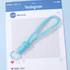Alça de celular DIY simples e durável com pingente de chaveiro na cor dopamina, acessório de pulseira anti-perda