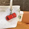 Llavero Creativo de Coche de Juguete Escarabajo de Doble Puerta Divertido Juguete de Descompresión para Estudiantes Colgante Regalo de Máquina de Garra Venta al por Mayor