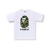 Comercio exterior mayorista transfronterizo estilo japonés moderno estampado de camuflaje cabeza de tiburón cabeza de tigre mono bloques de color luminoso para pareja camiseta holgada morada