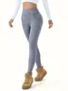 Leggings de forro polar de cordero de venta caliente transfronterizos otoño e invierno con terciopelo extra gruesos pantalones cálidos de lunares cintura alta adelgazantes pantalones de algodón