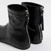 Versão em couro bovino~Botas de dedo dividido de nicho coreano, botas de salto escondido curtas, zíper traseiro, sola plana, botas Martin, botas femininas emagrecedoras