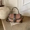 Bolsa de mão retrô europeia e americana transfronteiriça para mulheres, bolsa sela estilosa e da moda para o outono, bolsa de ombro e bolsa transversal versátil com estética vintage