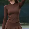 Ropa deportiva de tenis transpirable de manga larga ajustada con media cremallera transfronteriza para mujer, alta elasticidad, falda de tenis plisada de cintura alta anti-exposición