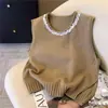 Chaleco de punto en capas de diseño elegante estilo coreano, nuevo modelo otoño e invierno 2026, chaleco de cuello redondo para mujer, moderno