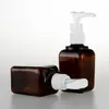 Botella cuadrada gruesa marrón de 80 ml con bomba de clip, envase cosmético, loción para lavarse las manos, botella vacía de PET dividida