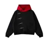 Sudadera con capucha de color bloqueado de tono oscuro, de nicho, con botones metálicos diagonales, tapeta irregular, corte holgado y hombros caídos, al por mayor