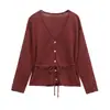 Fábrica en stock comercio exterior venta al por mayor ropa de mujer primavera 2025 nuevo cinturón cintura Joker manga larga tirantes suéter chaqueta