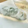 Pulsera de jade verde Tianshan de alta calidad, muy vendida, venta al por mayor de fabricantes, pulsera de jade dorado con flor flotante verde, pulsera clásica