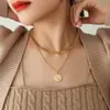 Collar de marca redondo de doble capa estilo ins de metal europeo y americano, diseño moderno, cadena para suéter de acero de titanio chapado en oro, no se decolora
