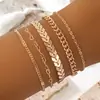 Conjunto de pulsera de cadena de oro de múltiples capas de hoja cruzada minimalista europeo y americano, moderno y elegante, pulsera retorcida en forma de corazón multicapa de lujo ligero