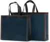 Bolsa no tejida en stock Impresión a color de película Bolso de mano para llevar ropa a domicilio Regalo publicitario Bolsa de compras promocional al por mayor