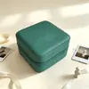 Popular en Europa y América, joyero compacto y portátil, caja de almacenamiento de accesorios de cuero, bolsa de almacenamiento antioxidante para pendientes, colgantes y anillos
