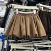 [Stock Listo de Fábrica] Falda de Suede con Capa de Aire y Botones para Mujer Nueva de Otoño e Invierno Falda Corta con Forma de A Hinchada