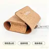 Nova bolsa de proteção ambiental com grão de cortiça para fone de ouvido bluetooth sem fio, bolsa de armazenamento de fone de ouvido bluetooth anti-pressão e queda, capa protetora, atacado