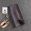 Nova Saia Midi de Couro Sintético com Fenda Traseira Outono/Inverno Europeia e Americana Cor Sólida Profissional Lápis One-step para Mulheres