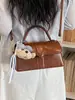 Bolsa de Mão da Moda Versátil com Textura de Alta Qualidade Estilo Coreano para Mulheres Novo Modelo Verão 2026 Bolsa Quadrada Pequena de Ombro Cruzado