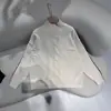 Suéter de comercio exterior ruso transfronterizo de bloques de color para otoño e invierno, cuello semialto, corte holgado, adelgazante, top de punto para mujer