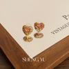 Nuevos aretes de amor con combinación de color de diamante de color, moda para mujer, aretes de lujo ligero dulces de alta gama, venta al por mayor de aretes