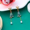 Nuevos aretes navideños europeos y americanos transfronterizos creativos Joker Navidad estrella de cinco puntas árbol de Navidad aretes de borla mujer mayoreo