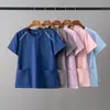 Nuevos uniformes de enfermería, batas médicas, ropa de trabajo, cuello en V de manga corta a prueba de salpicaduras, personalizables con logo, disponibles para venta al por mayor desde la fábrica de origen