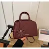 Mini bolso de mano estilo Chanel para bolos 2026, bolso de mano retro relajado, bolso de hombro y cruzado para mujer, moderno y versátil