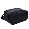 Elegante y práctica bolsa de aseo para hombre para viajes de negocios, con compartimentos multifuncionales, material impermeable y un asa conveniente para facilitar su transporte.