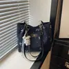 Bolsos tote de nicho populares para mujer de este año, nuevos y elegantes bolsos de hombro para el trabajo de la primavera de 2026, bolsos versátiles de axila