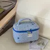 Bolso a cuadros estilo coreano nuevo para mujer, diseño transfronterizo, bolsa de almacenamiento portátil con compartimentos, bolsa de gran capacidad para cuidado de la piel y artículos de tocador