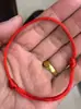 Puesto callejero Feria del Templo Venta caliente Pulsera de Cuerda Roja Jade Imitación Madera Imitación Pulsera Tejida de Cuerda Roja Actividad Mayorista Pequeño Regalo Obsequio